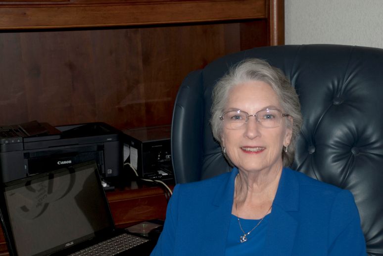 Lee Carver at her desk